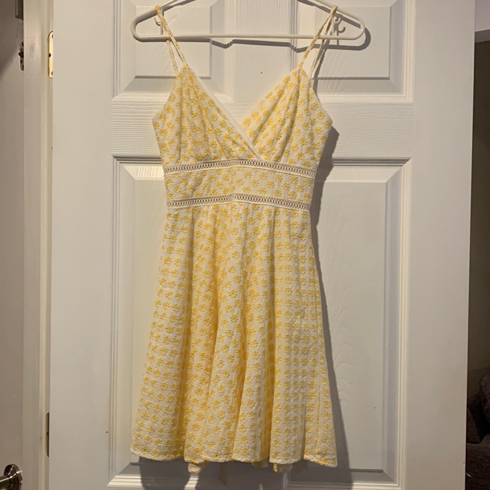 Brand new and never worn casual, short, yellow/white sundress.